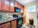 Clean and functional kitchen with ample cabinet space and granite countertops at 902 Charo Pkwy # 624, Davenport, FL 33897