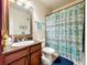 Clean bathroom with granite countertop, shower, and toilet at 902 Charo Pkwy # 624, Davenport, FL 33897