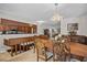 Elegant dining room with ornate wood table and chandelier at 121 E Lake Summit Dr, Winter Haven, FL 33884