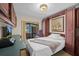 Multi-functional bedroom with a Murphy bed and a workspace at 121 E Lake Summit Dr, Winter Haven, FL 33884