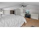 Cozy bedroom with twin beds, a TV, and ceiling fan at 121 E Lake Summit Dr, Winter Haven, FL 33884