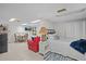 Comfortable bedroom with a queen bed and sitting area at 121 E Lake Summit Dr, Winter Haven, FL 33884