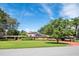 Ranch-style home with brick facade and solar panels at 121 E Lake Summit Dr, Winter Haven, FL 33884