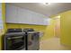 Functional laundry room with LG washer and dryer, plus extra storage at 121 E Lake Summit Dr, Winter Haven, FL 33884