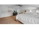 Serene bedroom with twin beds, a TV, and ceiling fan at 121 E Lake Summit Dr, Winter Haven, FL 33884