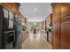 Open kitchen with stainless steel appliances and island at 121 E Lake Summit Dr, Winter Haven, FL 33884