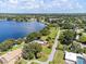 Waterfront property with expansive lake views and lush landscaping at 121 E Lake Summit Dr, Winter Haven, FL 33884