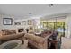 Living room features comfortable seating and lake view at 121 E Lake Summit Dr, Winter Haven, FL 33884