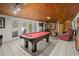 Basement game room with pool table, fireplace, and seating at 121 E Lake Summit Dr, Winter Haven, FL 33884