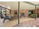 Relaxing screened patio with brick flooring, comfortable seating, and lovely lake views at 121 E Lake Summit Dr, Winter Haven, FL 33884