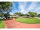 Ranch-style home with brick facade and solar panels at 121 E Lake Summit Dr, Winter Haven, FL 33884