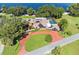 Lakefront property with pool and large circular driveway at 121 E Lake Summit Dr, Winter Haven, FL 33884
