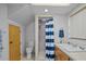 Updated bathroom with a shower, toilet, and wood vanity at 121 E Lake Summit Dr, Winter Haven, FL 33884