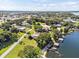 Expansive lakefront property with lush landscaping and a home at 121 E Lake Summit Dr, Winter Haven, FL 33884