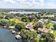 Stunning lakefront property, showcasing a home with dock and pool at 121 E Lake Summit Dr, Winter Haven, FL 33884