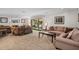 Living room with fireplace and view of the lake at 121 E Lake Summit Dr, Winter Haven, FL 33884