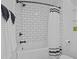 Clean bathroom with white subway tile, black fixtures, and a shower/tub combo at 121 E Lake Summit Dr, Winter Haven, FL 33884