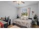 Bedroom with a daybed, desk, and window with blinds at 2158 Mirasol Dr, Winter Haven, FL 33881