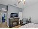Bedroom with fireplace, TV, and built-in desk area at 2158 Mirasol Dr, Winter Haven, FL 33881