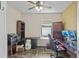 Home office with L-shaped desk, two monitors, and built-in shelving at 2158 Mirasol Dr, Winter Haven, FL 33881