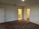 Bright bedroom with carpet flooring, ensuite bathroom, and walk-in closet at 177 Cimarron Ln, Kissimmee, FL 34759