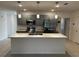 Modern kitchen with stainless steel appliances and island at 177 Cimarron Ln, Kissimmee, FL 34759