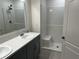Bathroom boasts double vanity, large shower, and modern finishes at 177 Cimarron Ln, Kissimmee, FL 34759