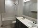 Bathroom with double vanity, shower, and bathtub at 177 Cimarron Ln, Kissimmee, FL 34759