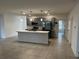 Modern kitchen with stainless steel appliances and island at 177 Cimarron Ln, Kissimmee, FL 34759