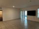 Spacious living room with sliding doors to the lanai at 177 Cimarron Ln, Kissimmee, FL 34759