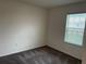 Bright bedroom with grey carpet and window blinds at 177 Cimarron Ln, Kissimmee, FL 34759