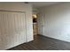 Bedroom with double doors leading to the kitchen at 177 Cimarron Ln, Kissimmee, FL 34759