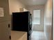Laundry room with washer, dryer, and extra cabinets at 177 Cimarron Ln, Kissimmee, FL 34759