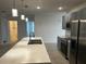 Modern kitchen with stainless steel appliances and island at 177 Cimarron Ln, Kissimmee, FL 34759