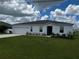 Newly built home with a two-car garage and neatly landscaped yard at 177 Cimarron Ln, Kissimmee, FL 34759