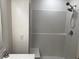 Large walk-in shower with built-in seat and tile surround at 177 Cimarron Ln, Kissimmee, FL 34759