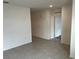 Open concept living room with tile floors and neutral colors at 177 Cimarron Ln, Kissimmee, FL 34759