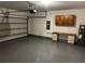 Attached garage with storage cabinets and workbench at 177 Cimarron Ln, Kissimmee, FL 34759