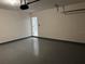 Spacious garage with painted floor and ample storage at 177 Cimarron Ln, Kissimmee, FL 34759
