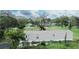 Aerial view of a mobile home with a trampoline and surrounding trees at 1815 Christy Ln, Lakeland, FL 33801