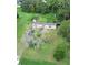 Aerial view of a mobile home on a large lot with trees and shed at 1815 Christy Ln, Lakeland, FL 33801