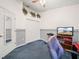 Spacious home office with a desk, chair, and ample closet space at 716 Challenger Ave, Davenport, FL 33897