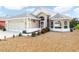 Single-story home with attached garage and well-maintained landscaping at 716 Challenger Ave, Davenport, FL 33897