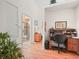 Home office with a desk and view into the bathroom at 716 Challenger Ave, Davenport, FL 33897
