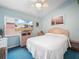 Bright bedroom with a comfortable bed and ceiling fan at 716 Challenger Ave, Davenport, FL 33897