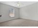 Bright bedroom with ceiling fan and window at 816 W Hancock St, Lakeland, FL 33803