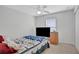 Bedroom with bed, TV, and ceiling fan at 816 W Hancock St, Lakeland, FL 33803