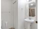 Clean bathroom with pedestal sink and shower/tub combo at 816 W Hancock St, Lakeland, FL 33803