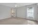 Bright bedroom with carpet flooring and a walk-in closet at 816 W Hancock St, Lakeland, FL 33803