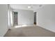 Bedroom with carpet flooring and ceiling fan, near bathroom at 816 W Hancock St, Lakeland, FL 33803